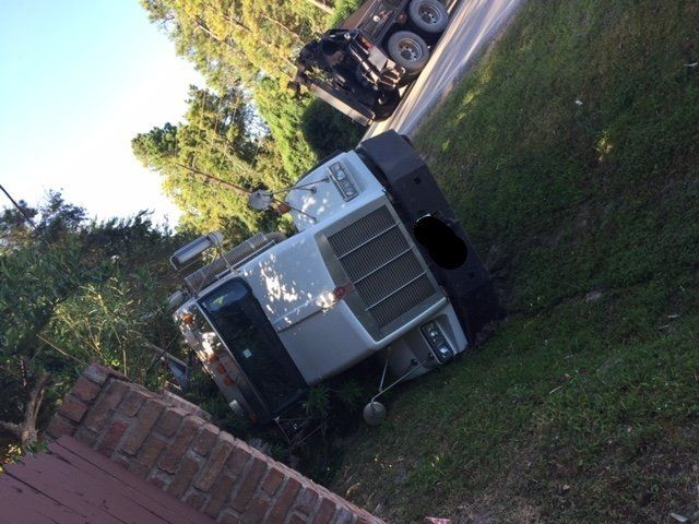 Truck — White Truck Tipped Over in Houston, TX