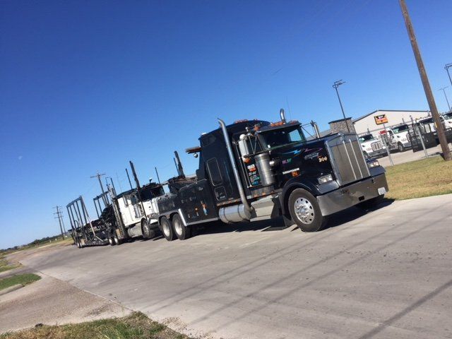 Auto Recovery — Towing a Trailer Truck on Road in Houston, TX