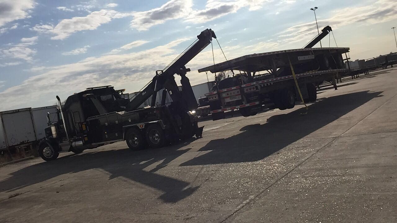 Vehicle Recovery — Black Towing Truck in Houston, TX