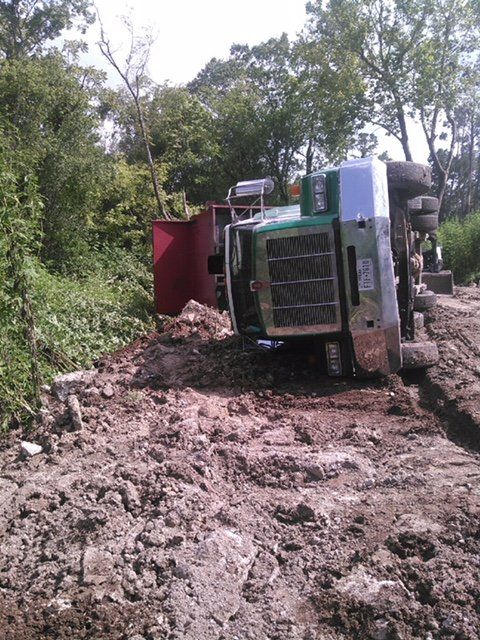Semi-truck Recovery — Tipped Over Truck on a Muddy Road in Houston, TX