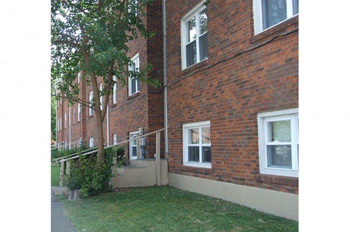 Room with hardwood floor.
