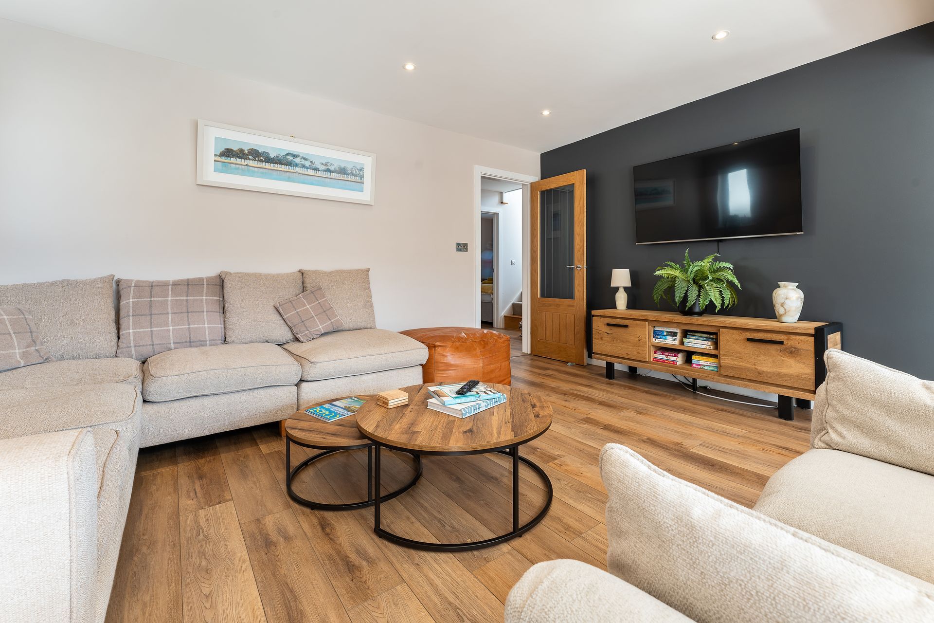 A living room filled with furniture and a flat screen tv.