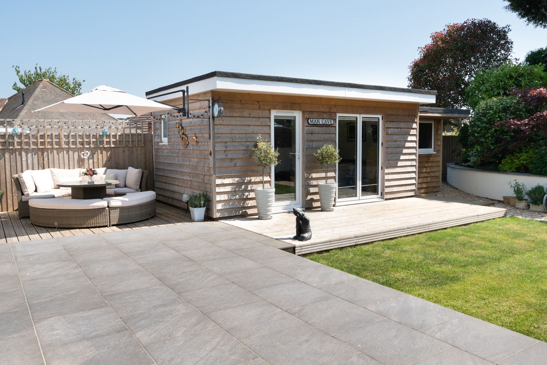 A small house with a patio in front of it
