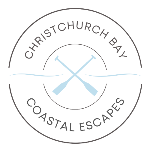 A logo for christchurch bay coastal escapes