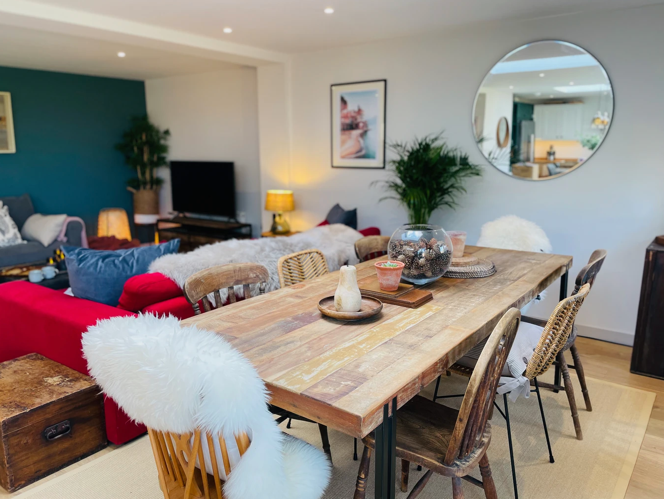 A living room with a wooden table and chairs