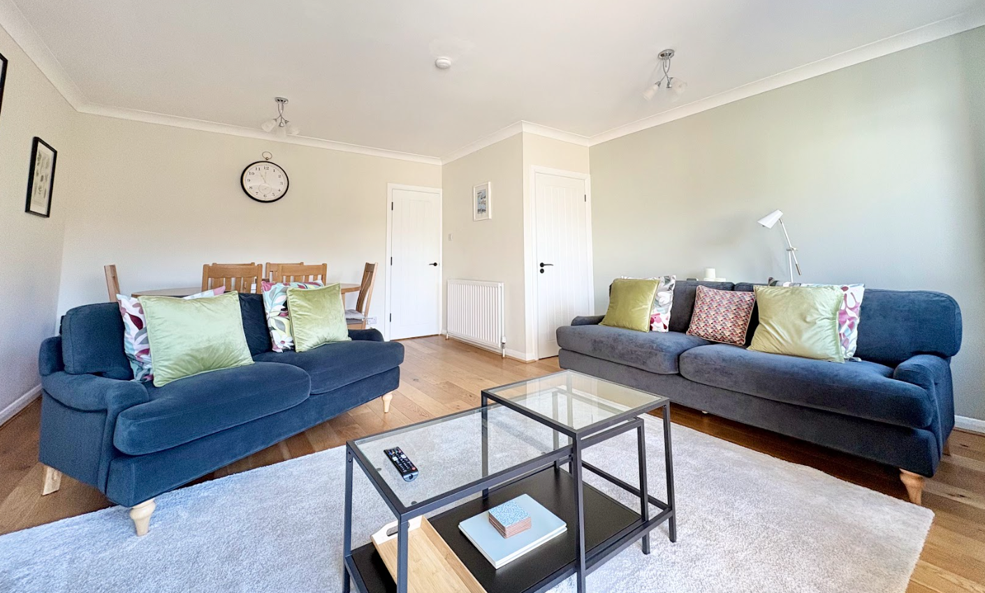 A living room with two couches and a coffee table.