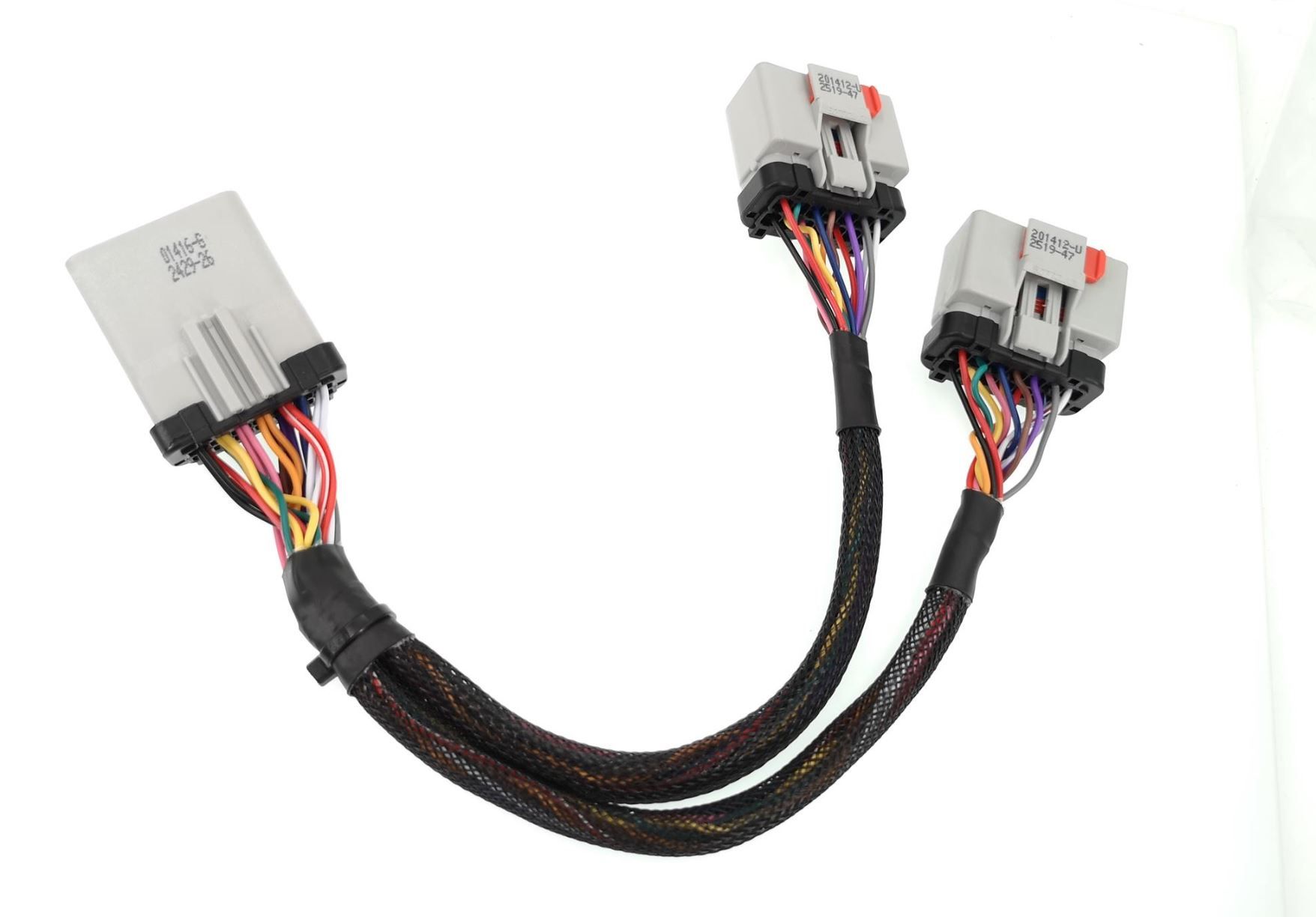 A close up of a cable with two connectors on a white background.