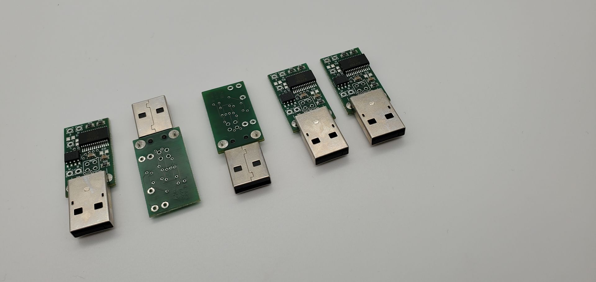 A group of usb connectors are sitting on top of each other on a white surface.