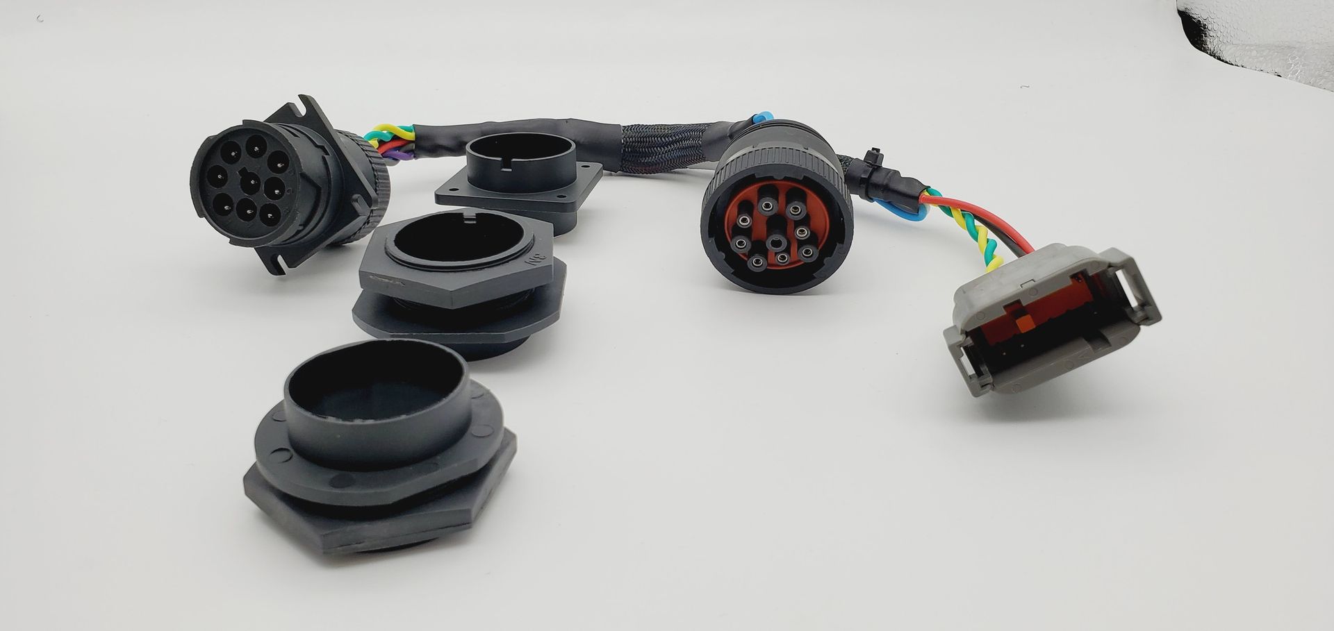 A bunch of wires are connected to each other on a white surface.