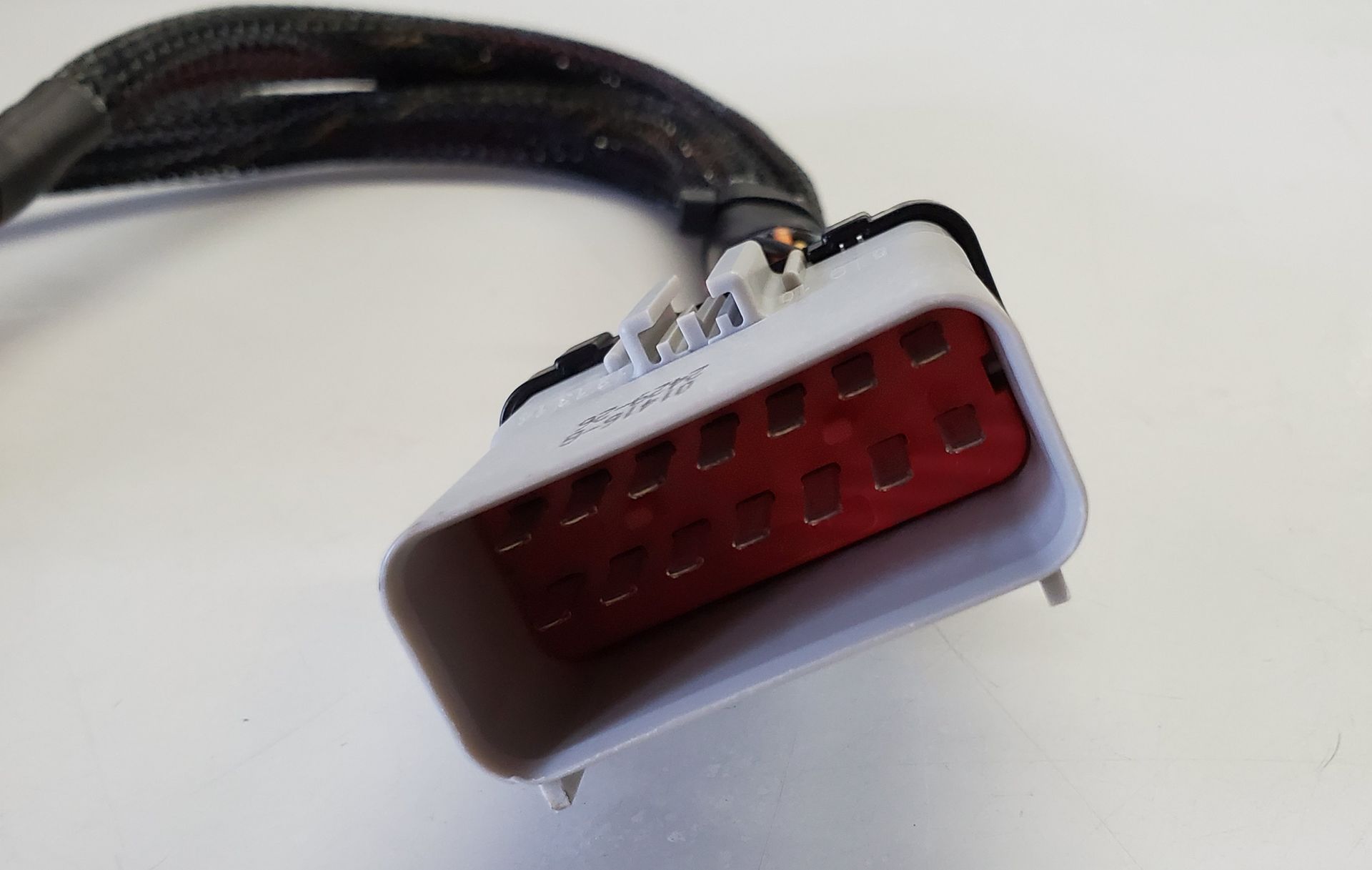 A close up of a connector on a white surface