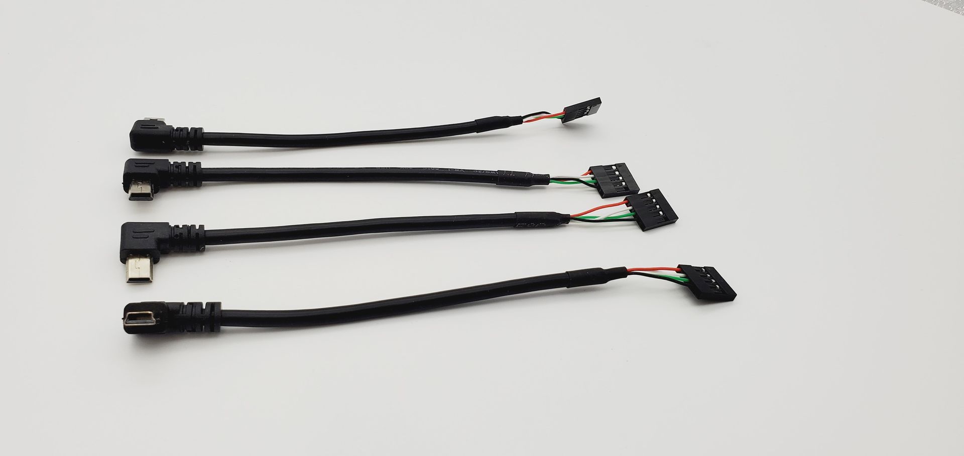 A bunch of wires are sitting on a white surface.