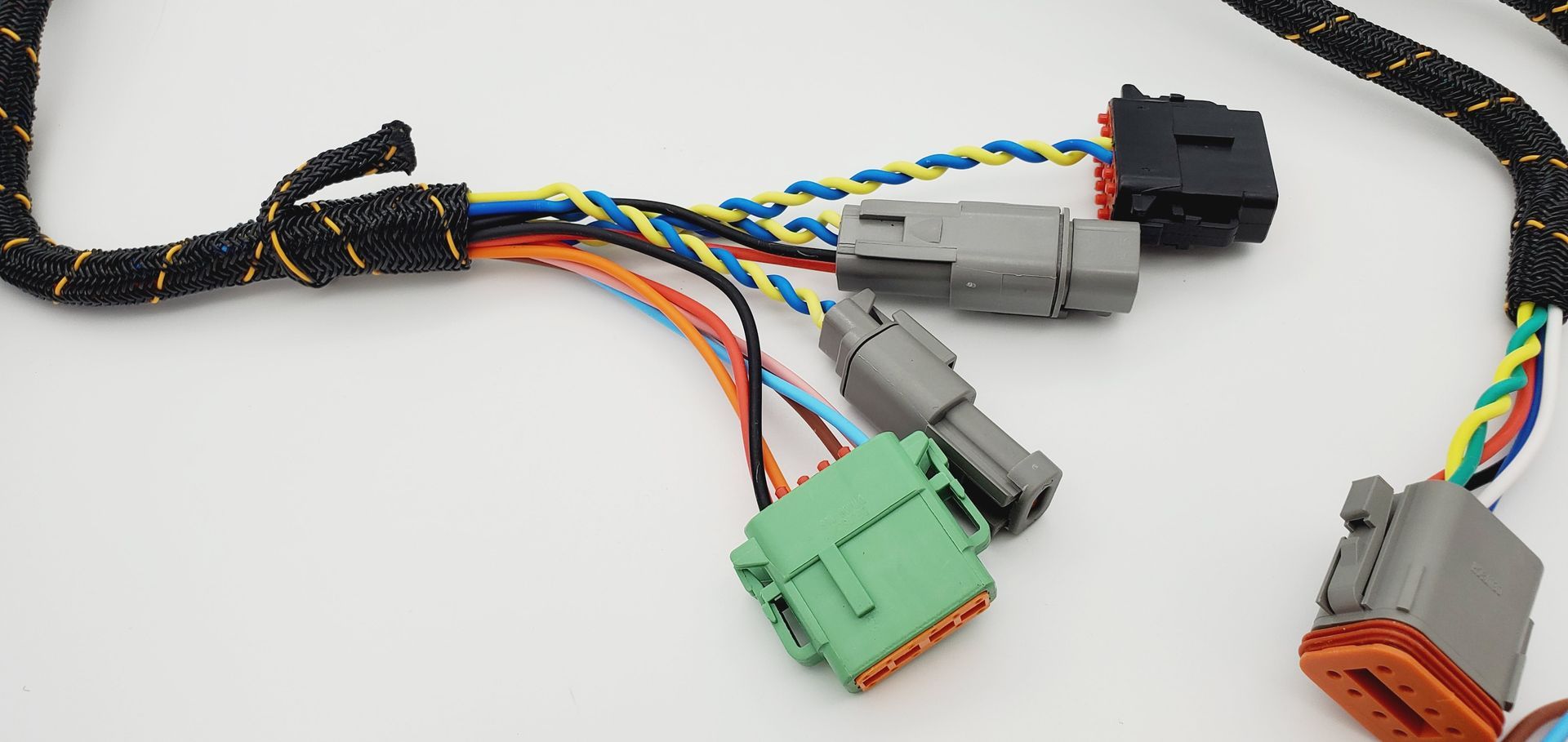 A bunch of wires are connected to each other on a white surface.