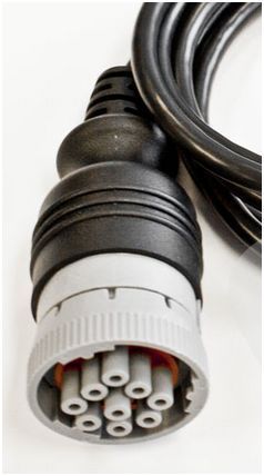 A close up of a connector on a cable on a white background.