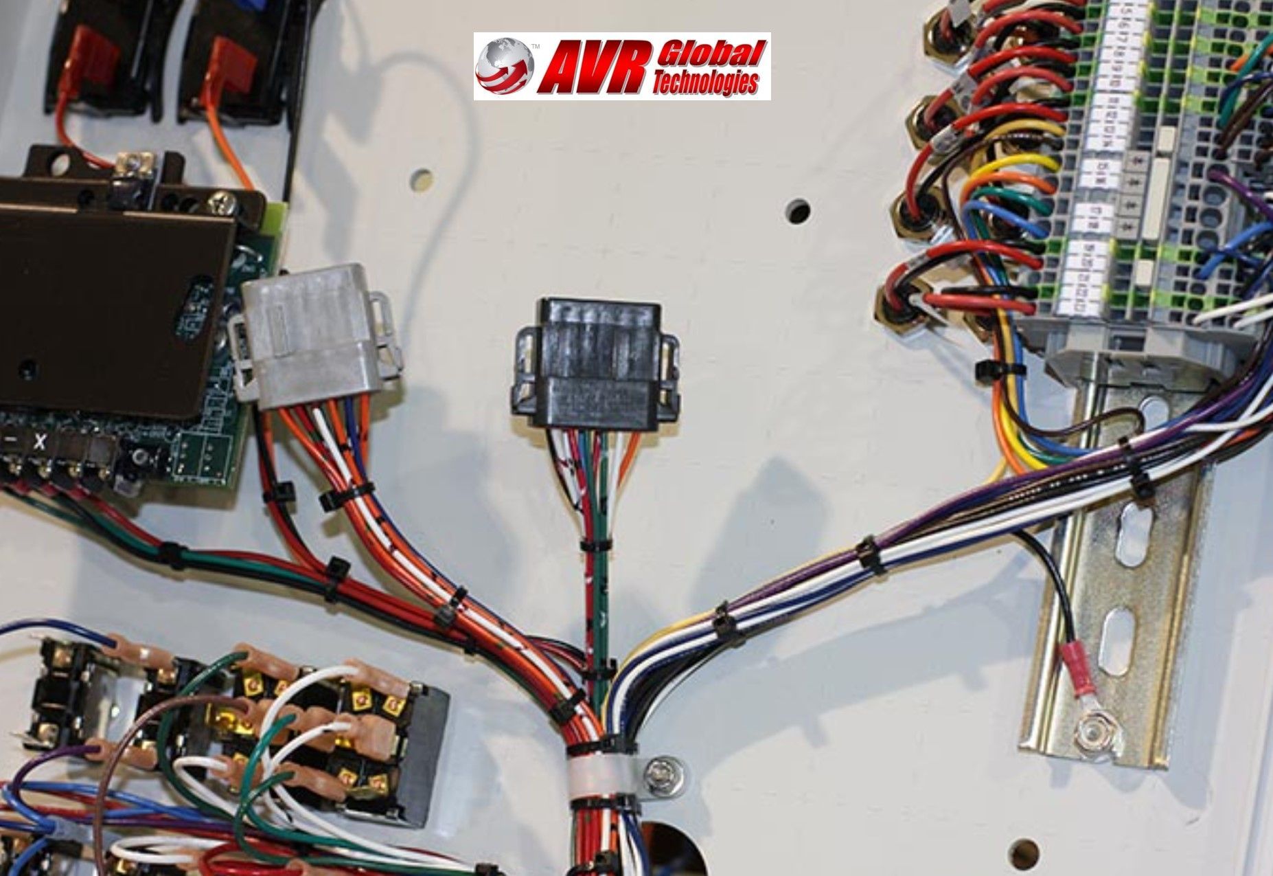 A bunch of wires are connected to a board that says avr global technologies