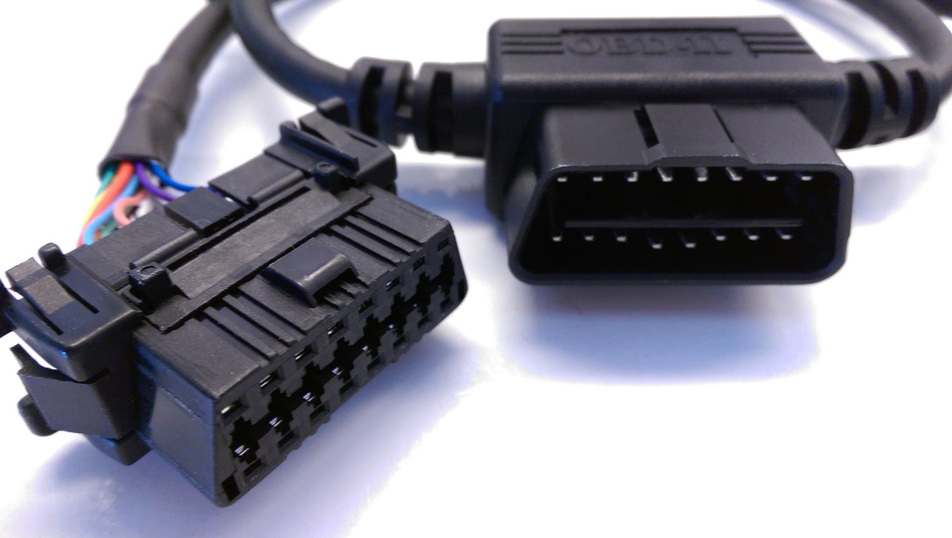 A close up of an oem connector on a white surface