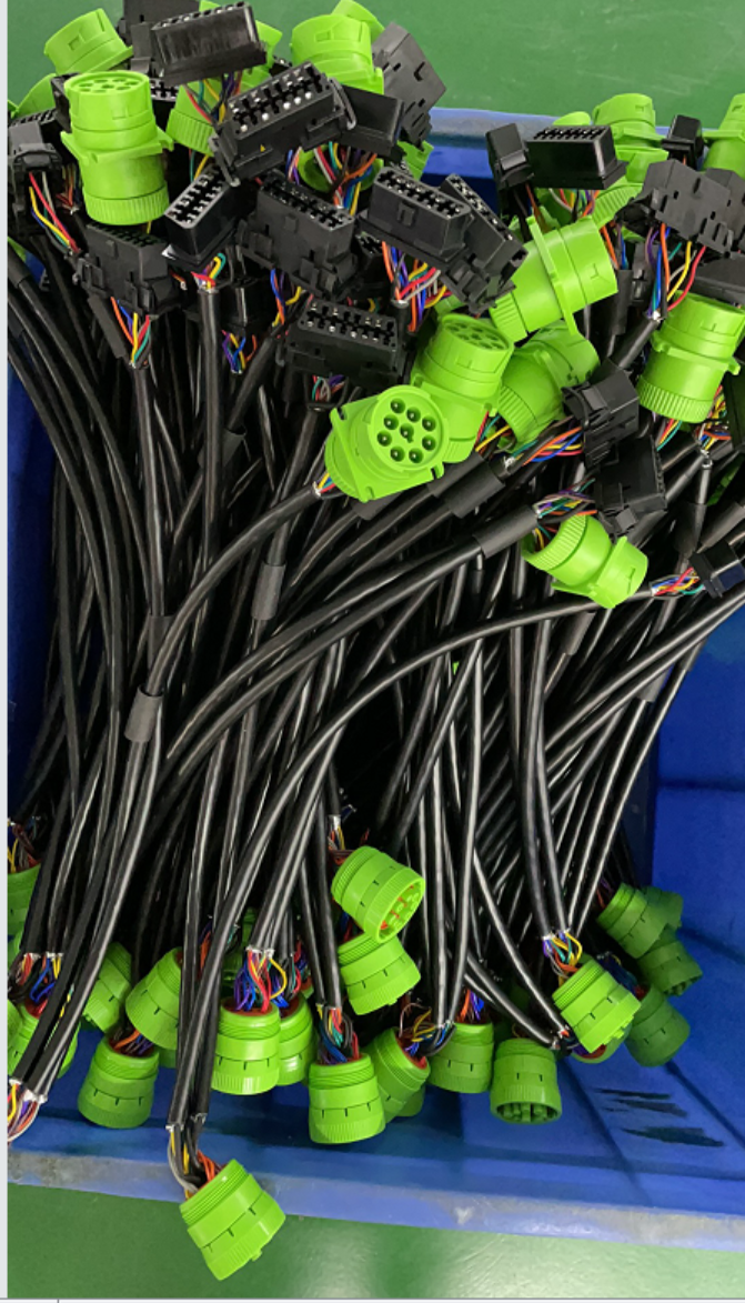 A bunch of wires are sitting in a blue container.