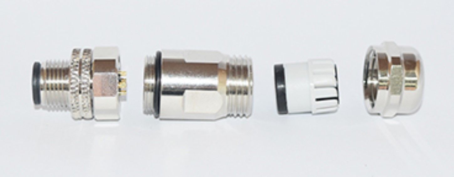 A group of metal objects are sitting on top of each other on a white surface.