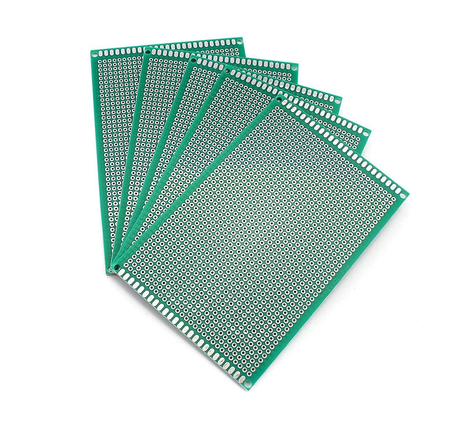 A bunch of green cards are stacked on top of each other on a white background