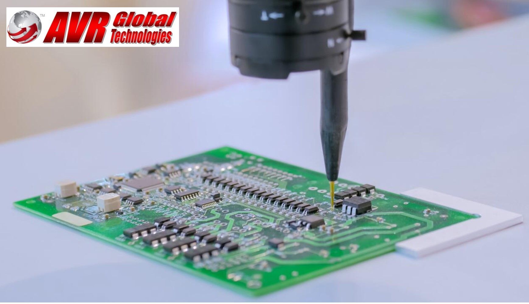 A green motherboard is being inspected by a microscope from avr global technologies