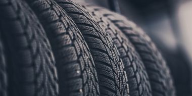 A close up of two tires stacked on top of each other.