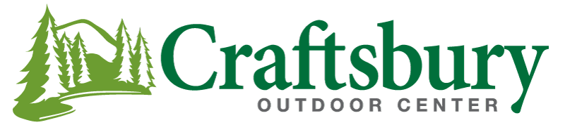 Craftsbury Outdoor Center logo with green trees and mountains.
