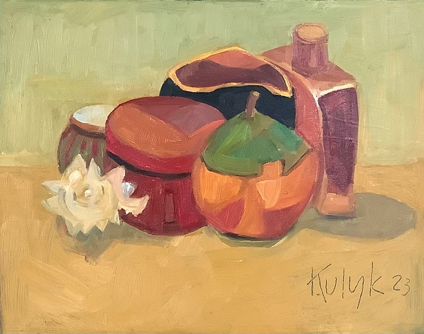 ©Karen Kulyk - Colorful garden scene with chairs, table, and umbrella surrounded by lush foliage and flowers.