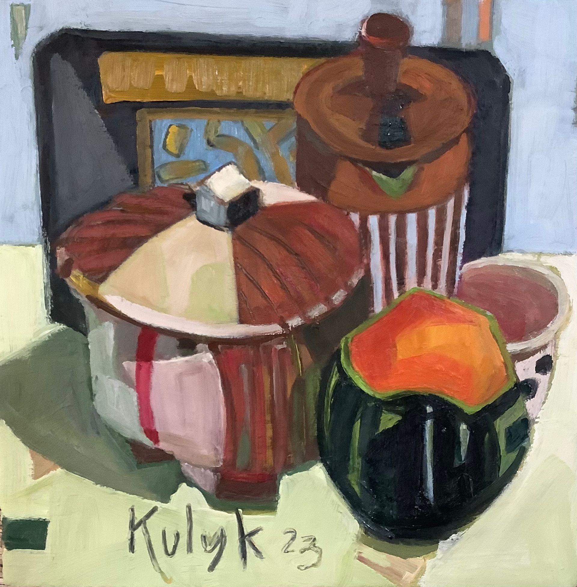 ©Karen Kulyk - Lush garden scene with a red tree in the foreground and vibrant foliage.