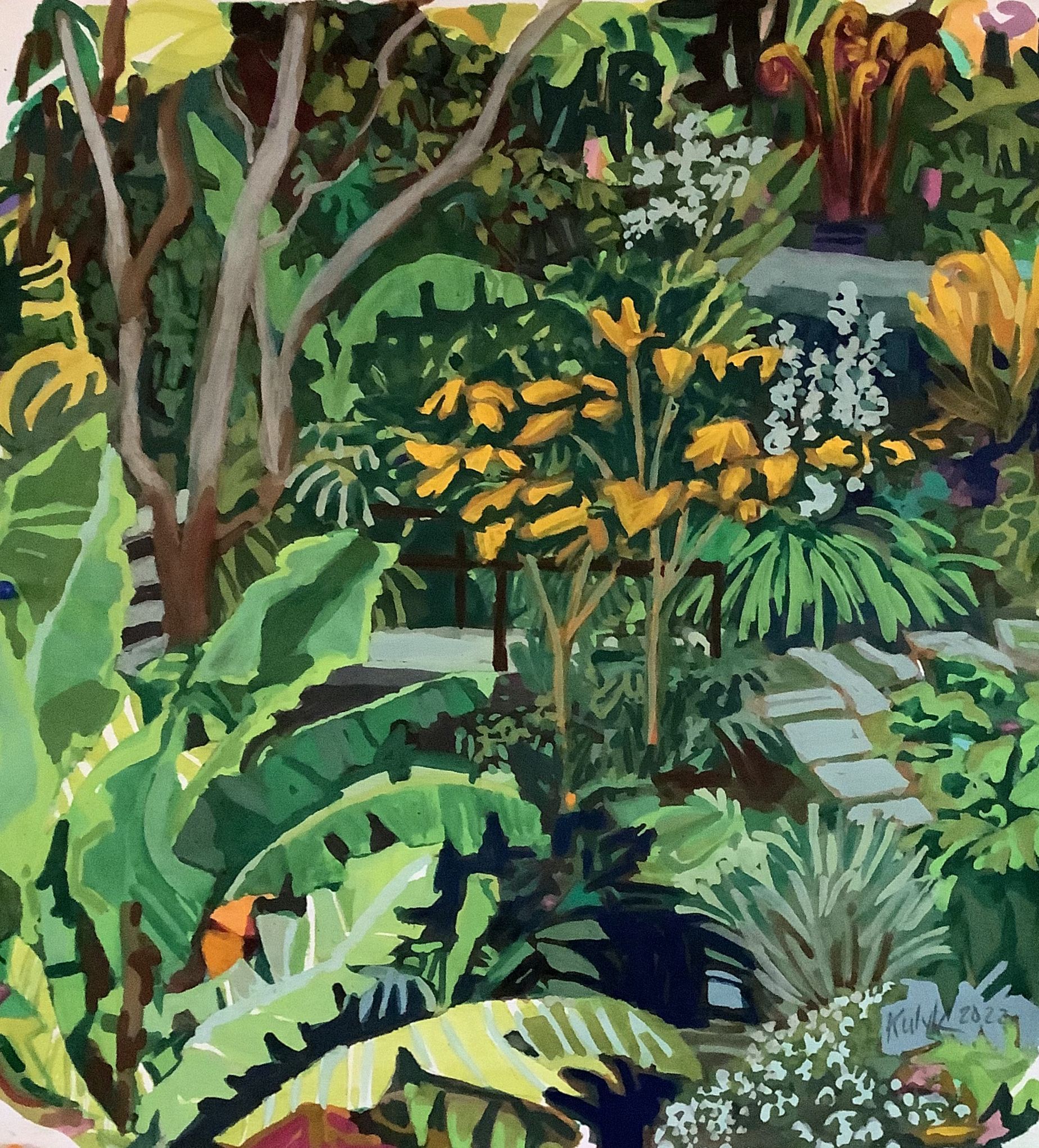 ©Karen Kulyk - Lush green garden scene with banana leaves, flowering bushes, and stone path.