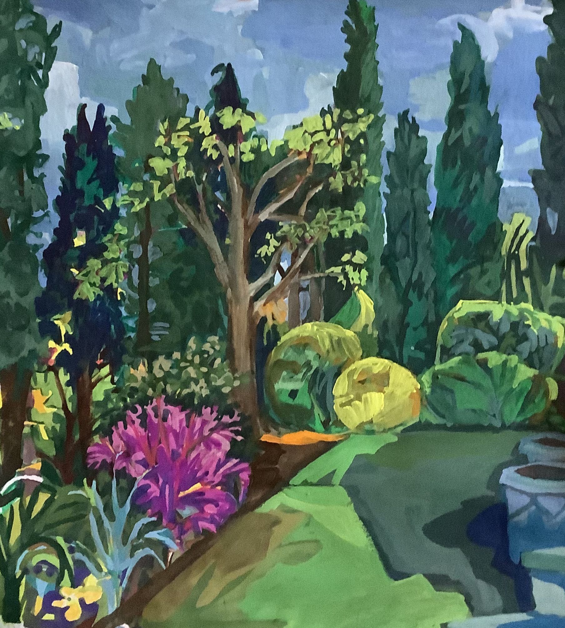 ©Karen Kulyk - Garden scene with colorful trees and plants under a cloudy blue sky.