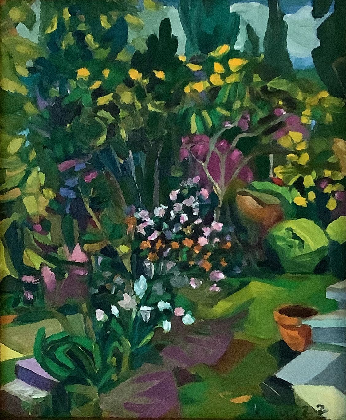©Karen Kulyk - Lush garden scene. Green and yellow foliage frames colorful flowers, a terracotta pot, and steps in sunlight.