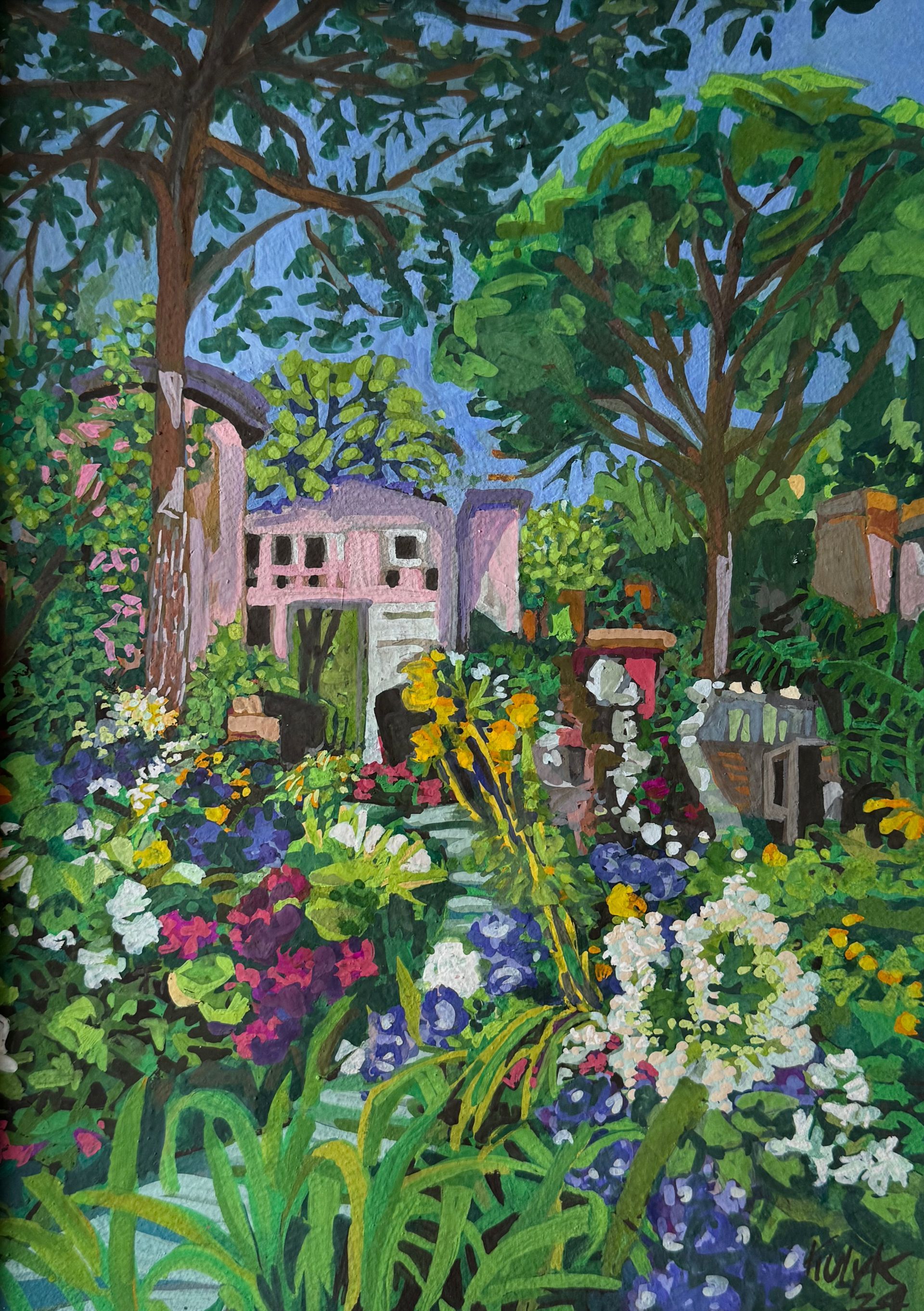 ©Karen Kulyk - A colorful garden with a house in the background, trees above, and blooming flowers in foreground.
