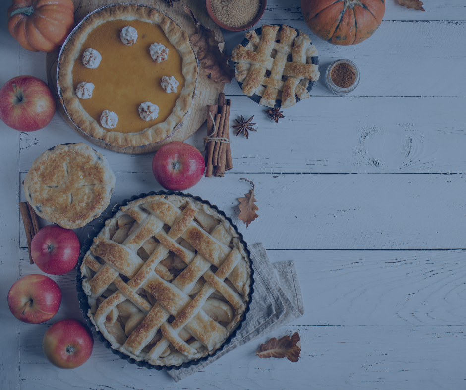 There are many different types of pies on the table.