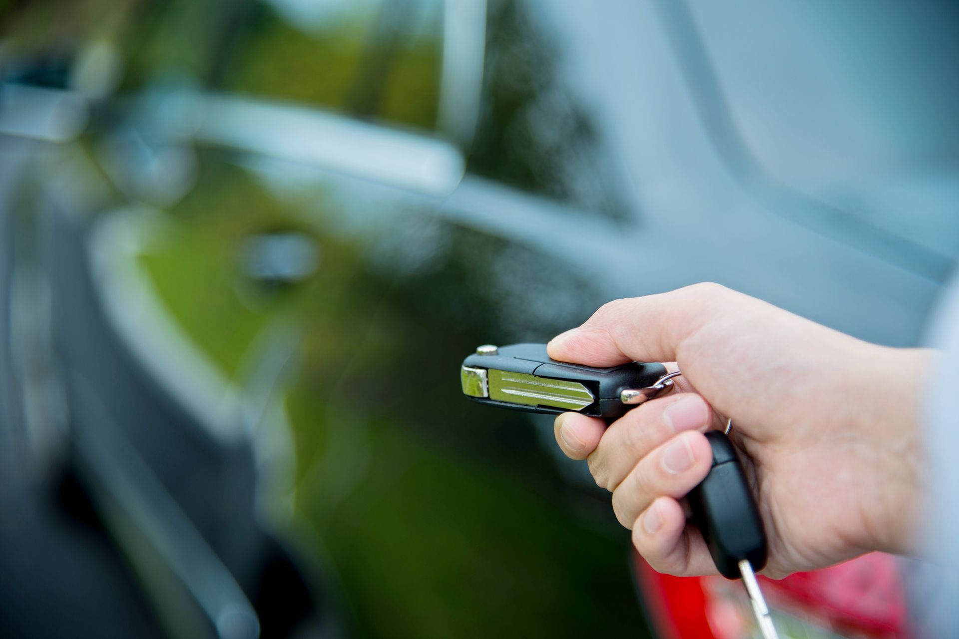 Unlocking a car with a key fob, showing the benefits of securing an auto loan in Gonzales, LA. Unlocking a car with a key fob, showing the benefits of securing an auto loan in Gonzales, LA.