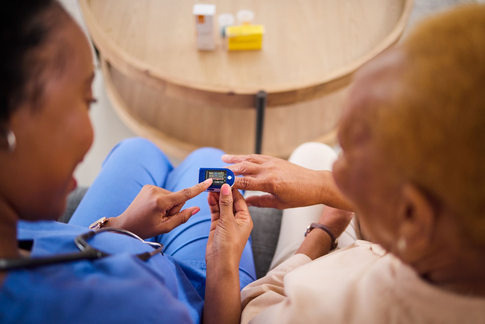 nurse taking patient blood pressure