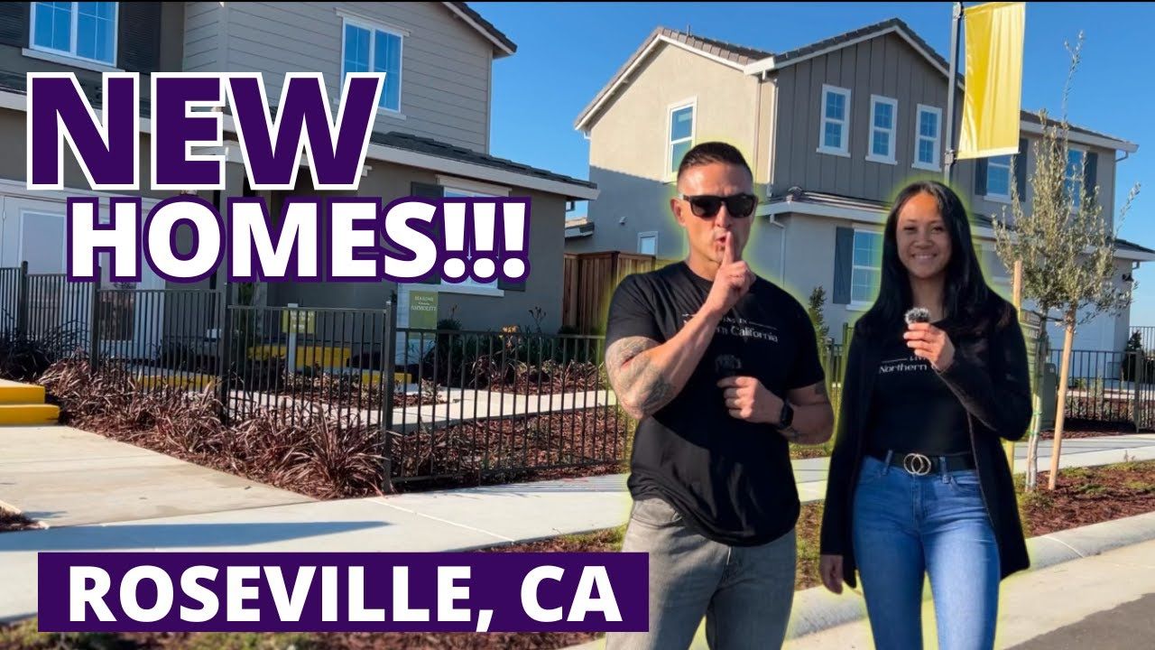 Two people in front of new homes in Roseville, CA. Man gestures to be quiet. Woman holds a microphone.