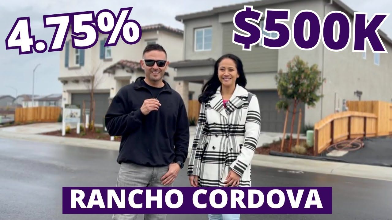 Man and woman in front of a house, text says