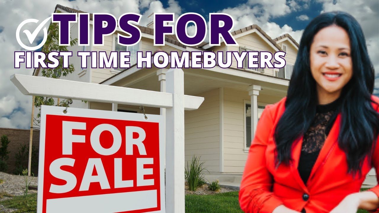 Woman in red blazer smiles beside a