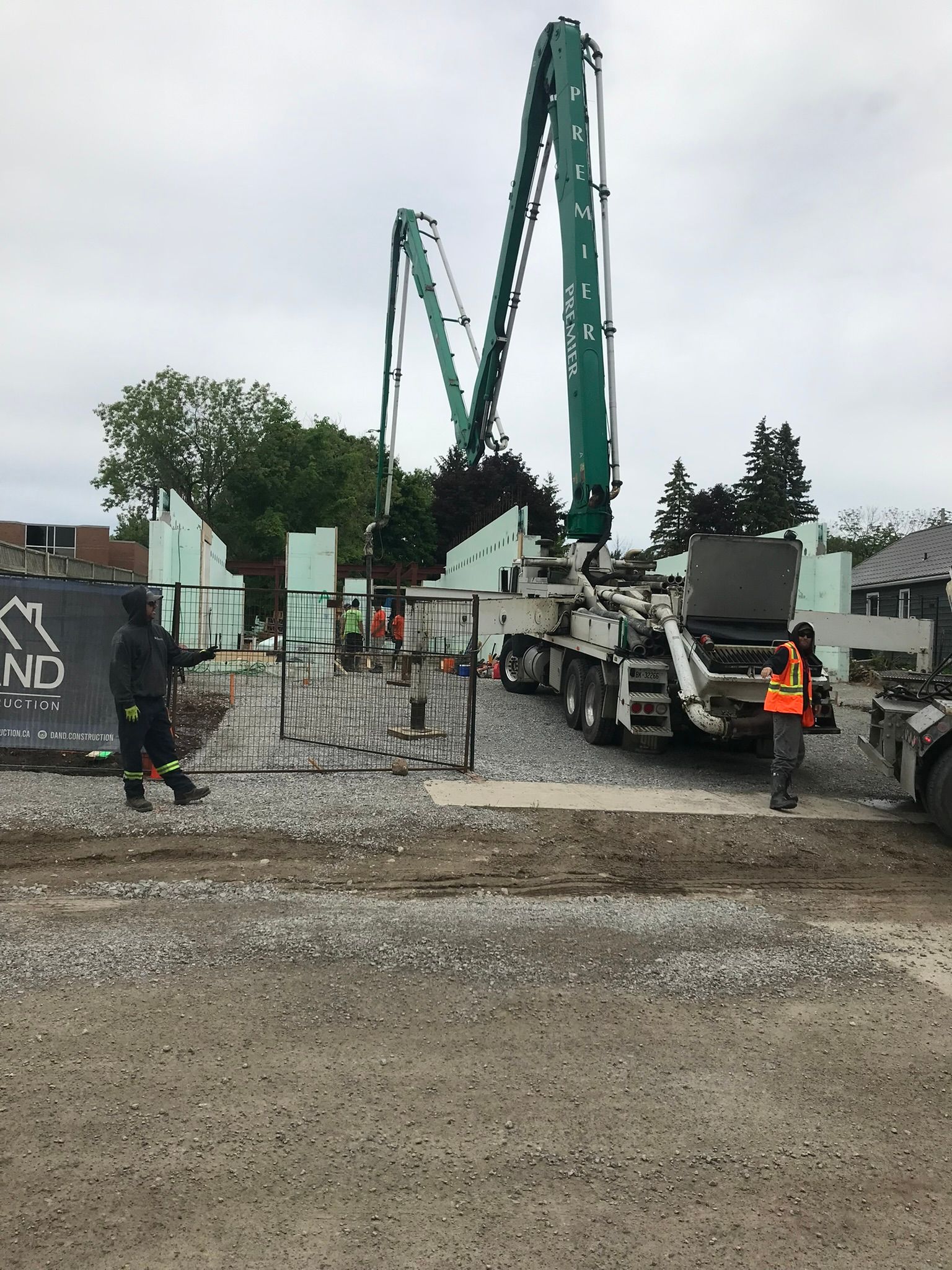 A concrete pump is being used on a construction site.