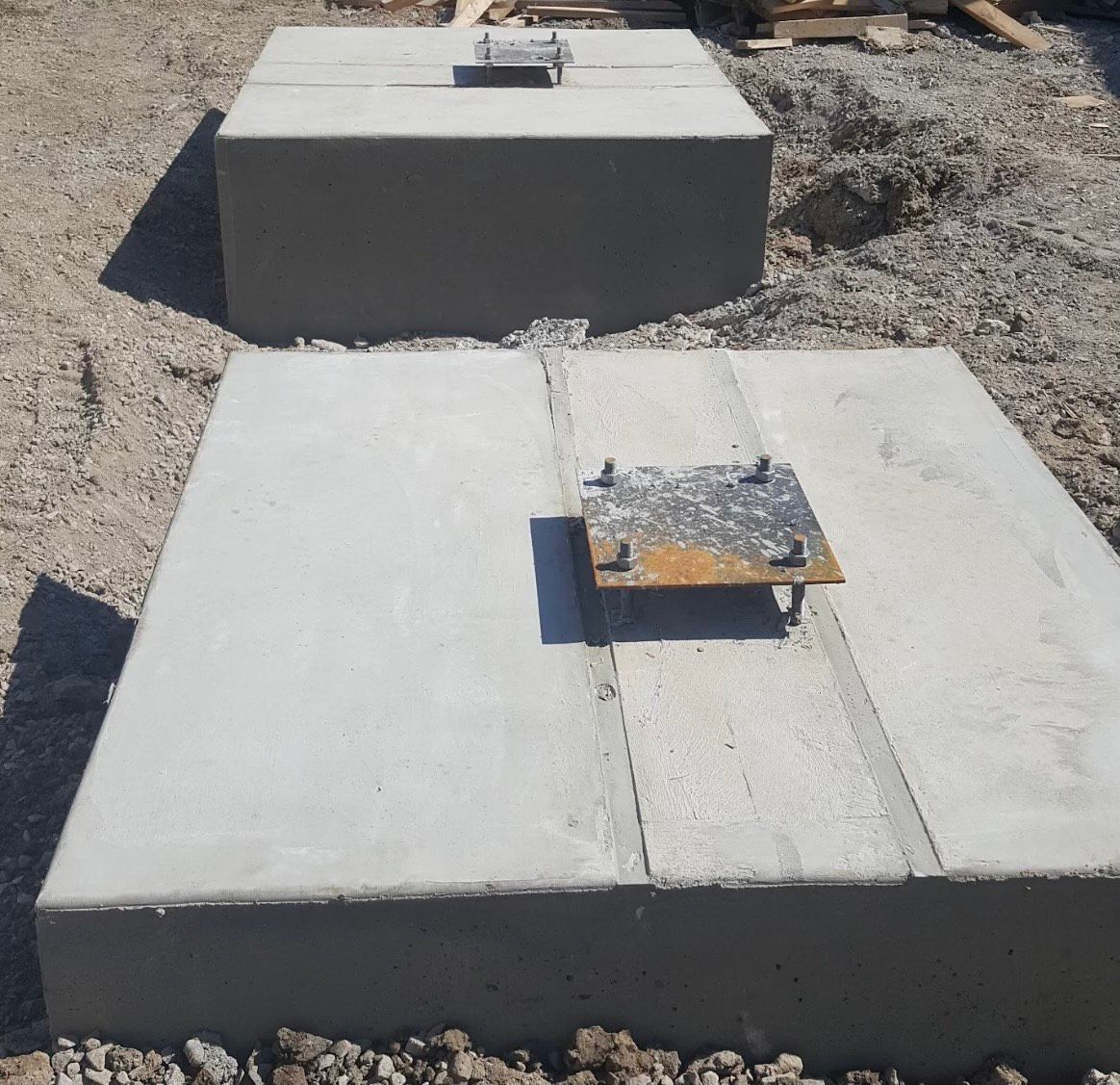 A concrete block with a metal plate attached to it