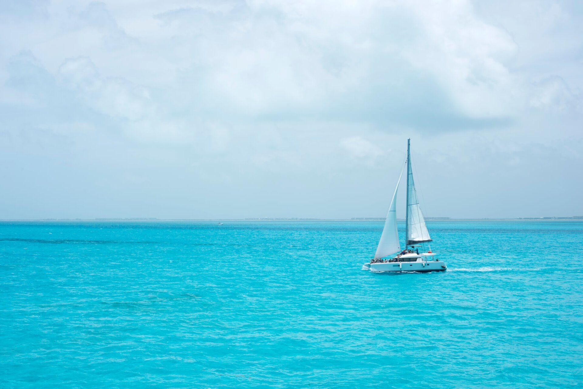 catamaran in the middle of a pristine sea