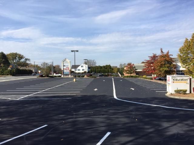 A parking lot with a sign that says ' education ' on it