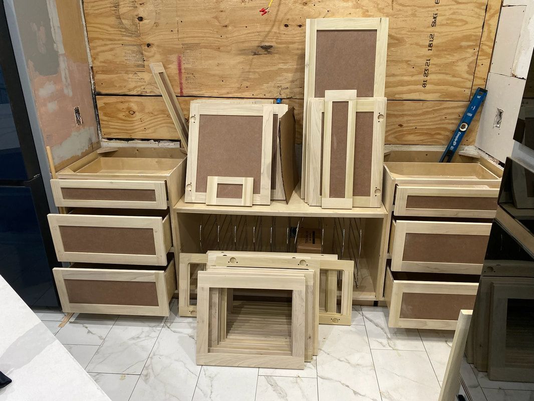 A bunch of wooden boxes are sitting on top of each other in a room.
