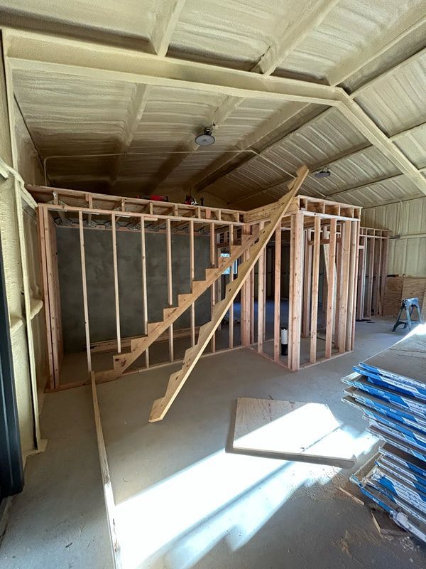 A room with stairs being built in it.