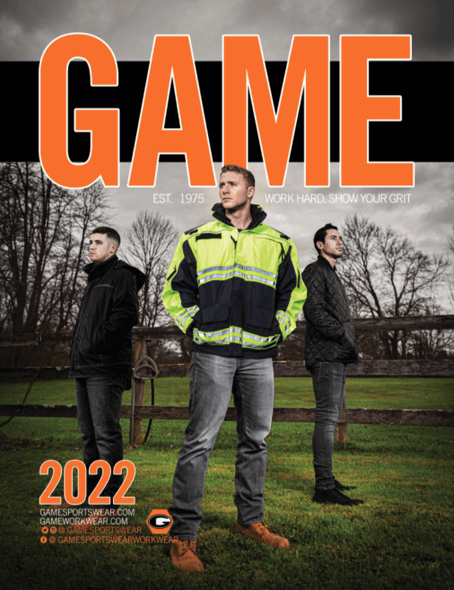 A group of men are standing in a field on the cover of a game magazine.