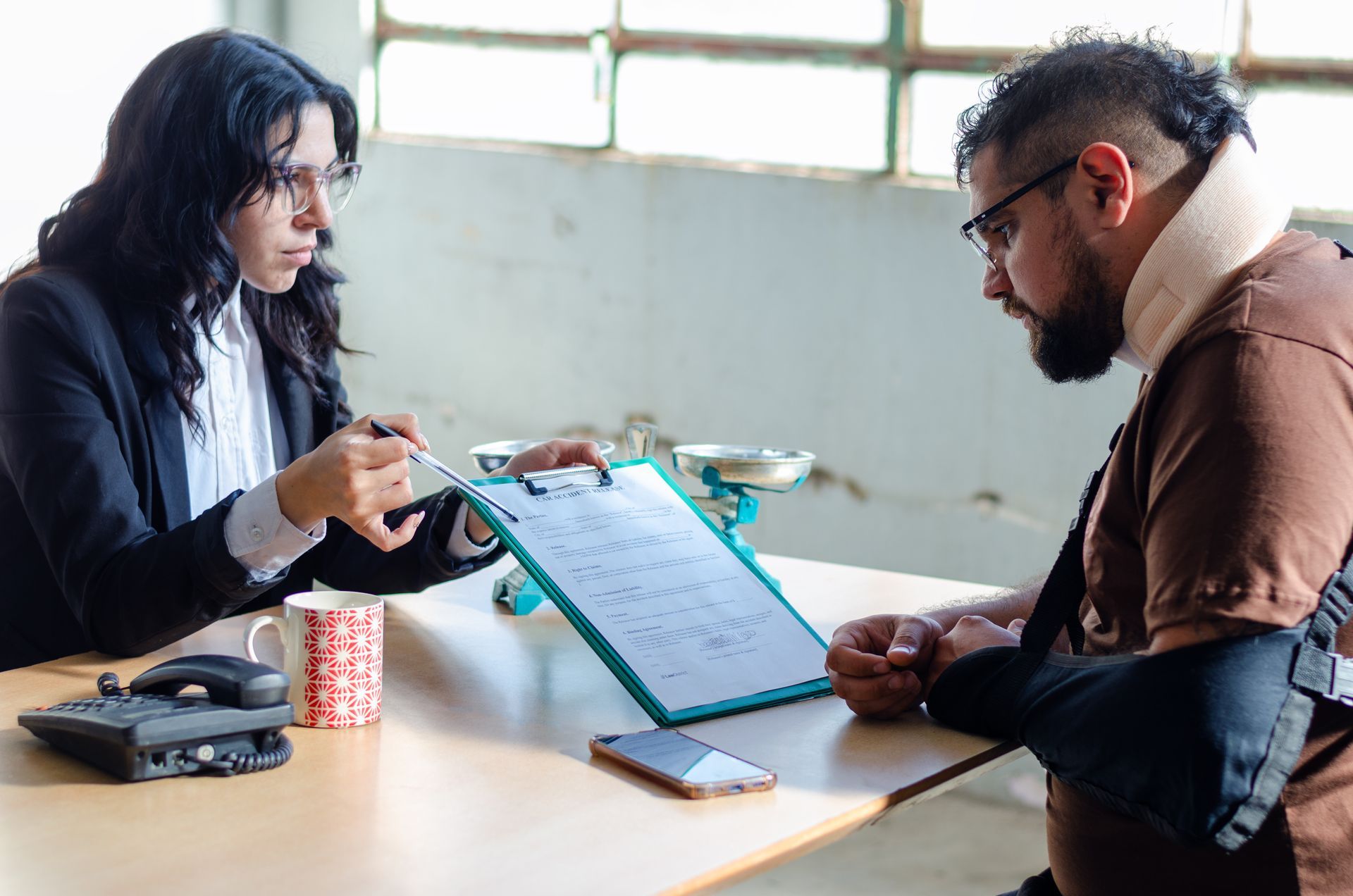 A lawyer assists an injured man with a legal problem.