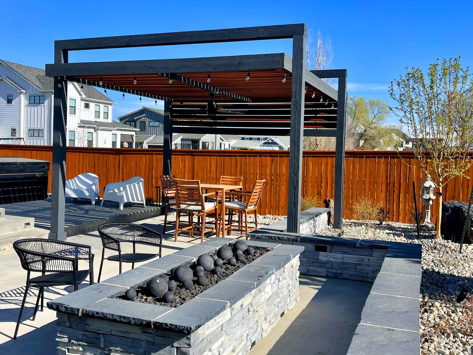 There is a fire pit in the middle of the patio.