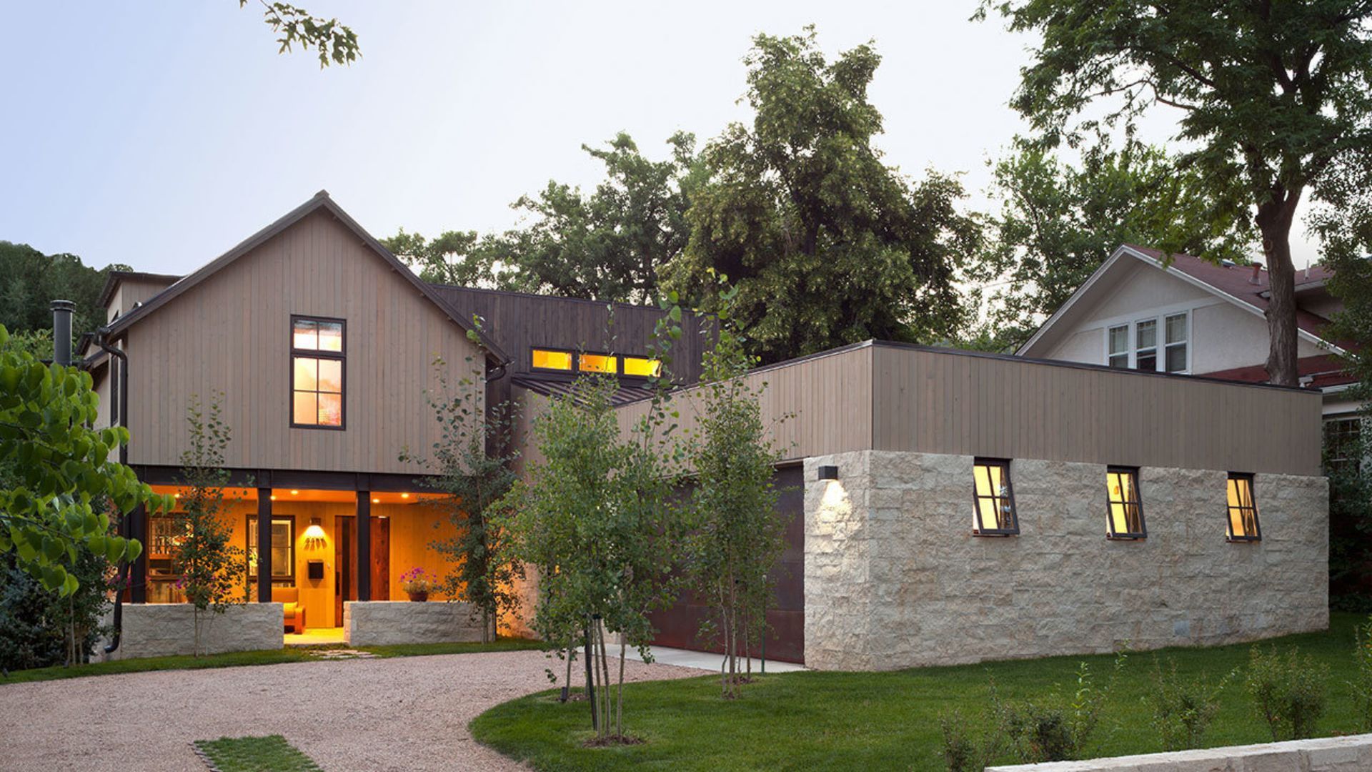A house with a lot of windows and a gravel driveway brandon rearick englewood colorado
