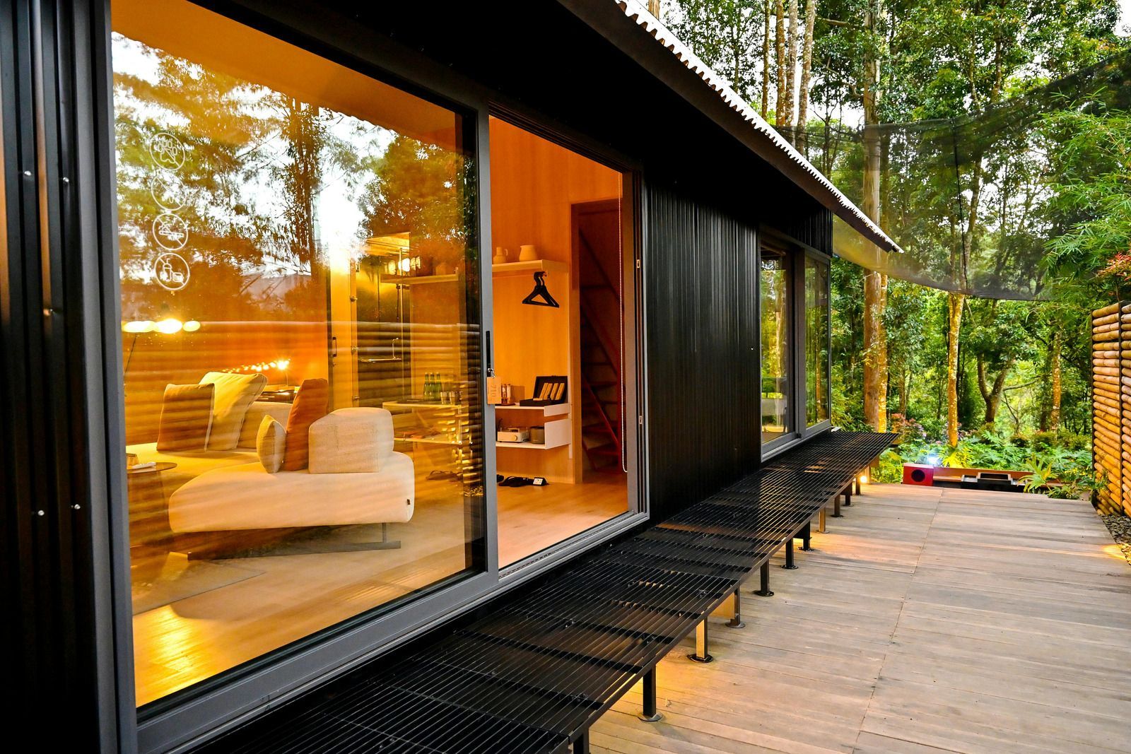 A large house with a round roof and a red door