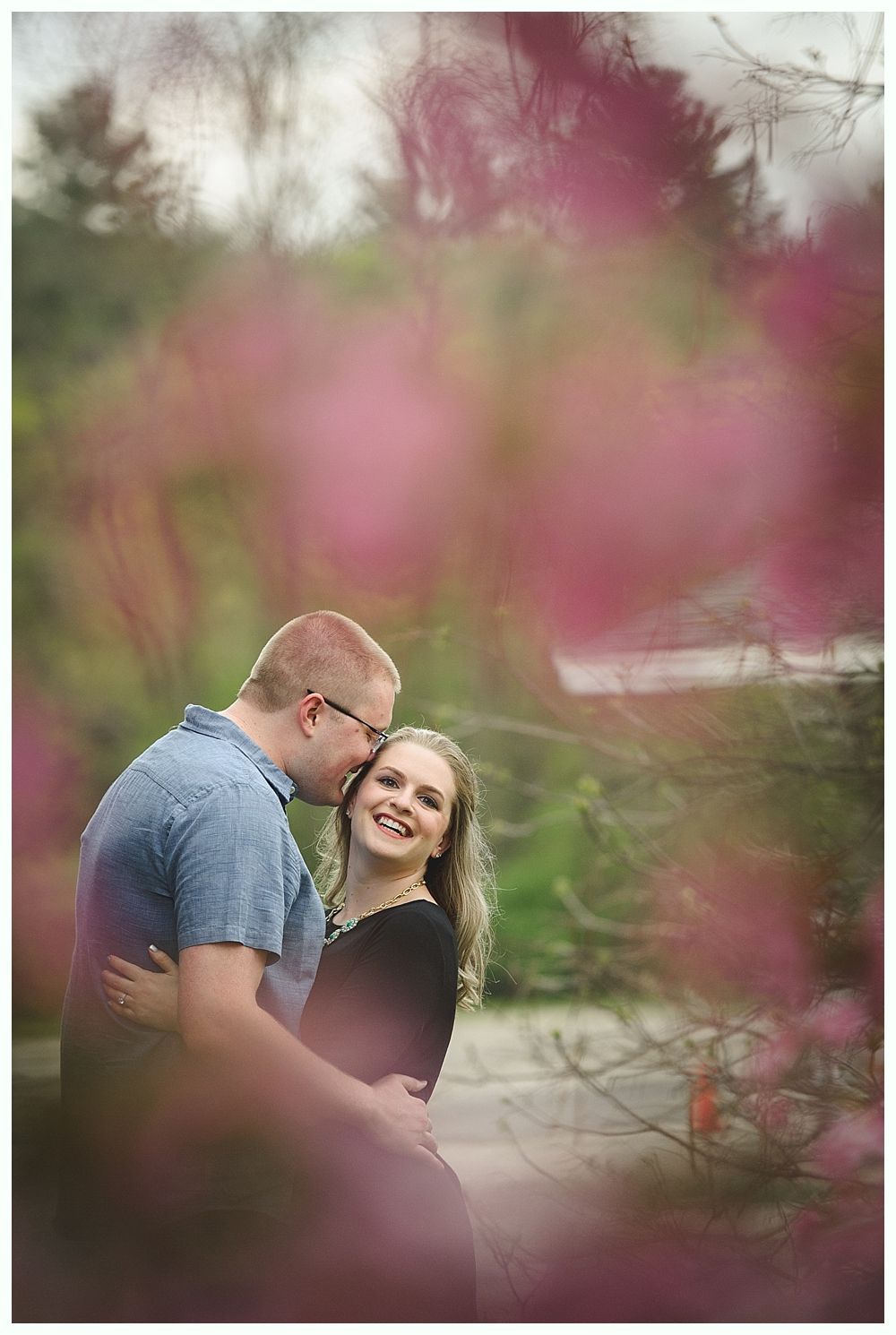 Wedding party toasting with beer bottles in an outdoor setting; sunflowers and smiles.