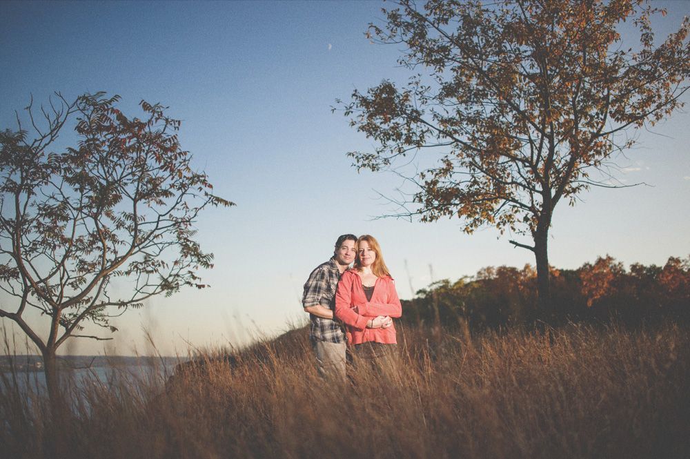 Wedding party toasting with beer bottles in an outdoor setting; sunflowers and smiles.